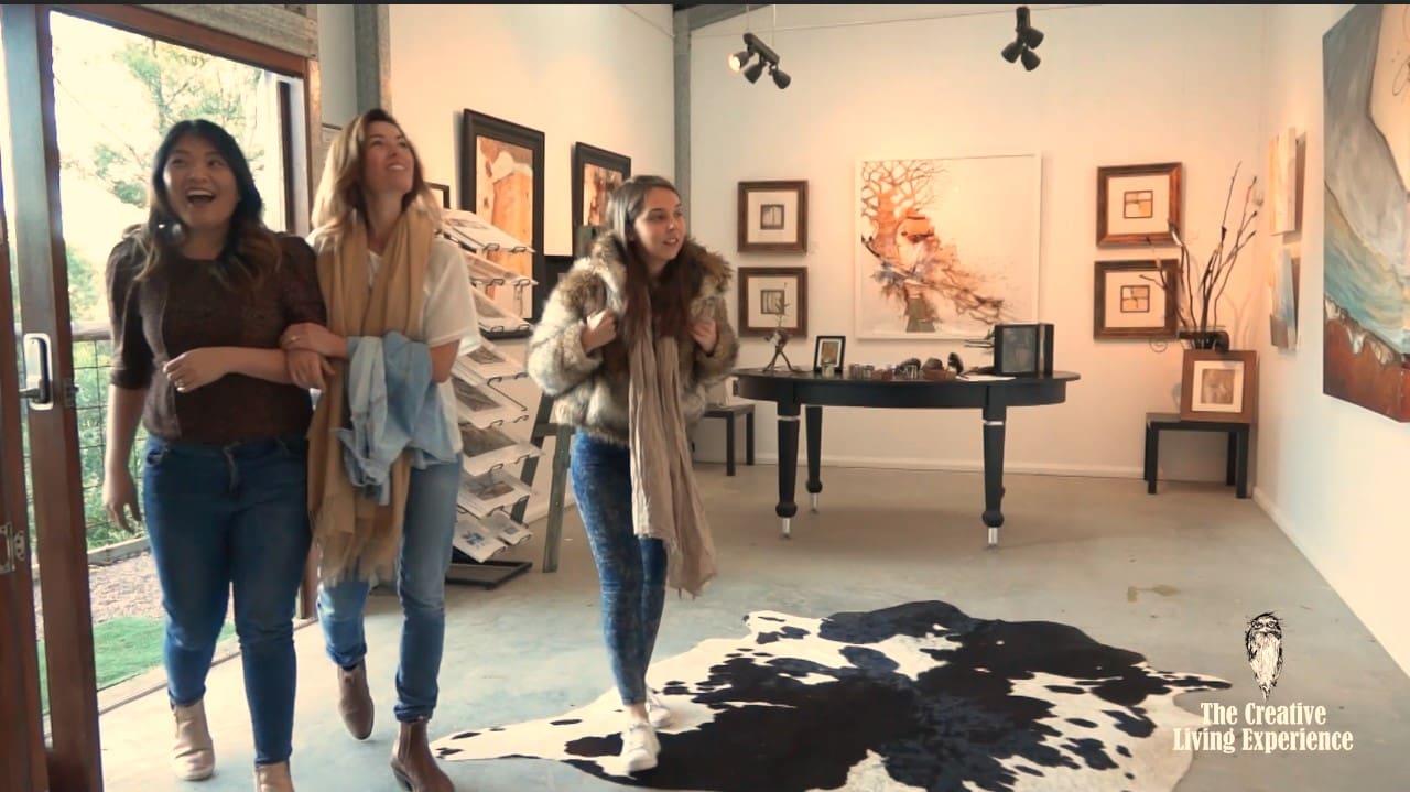 Tawny Trails visitors to gallery space, with big smiles