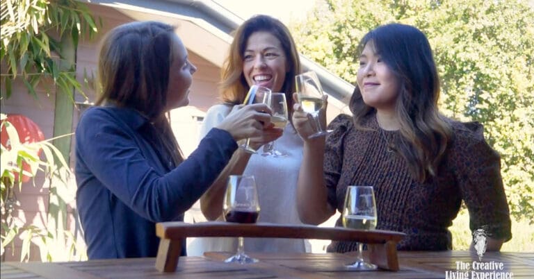 Three happy women enjoying a great lifestyle on Tawny Trails, sampling wine